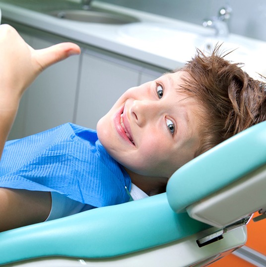 happy child getting a children’s dental checkup & cleaning in Flower Mound