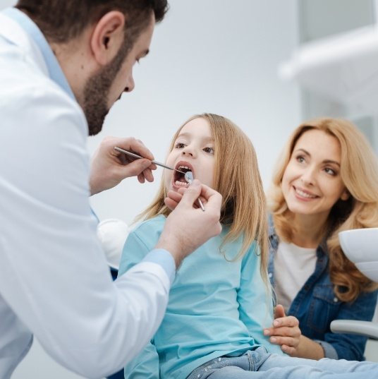 Child receiving treatment following a common dental emergency