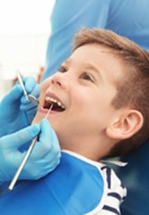 Double Oak pediatric dentist examining child's teeth