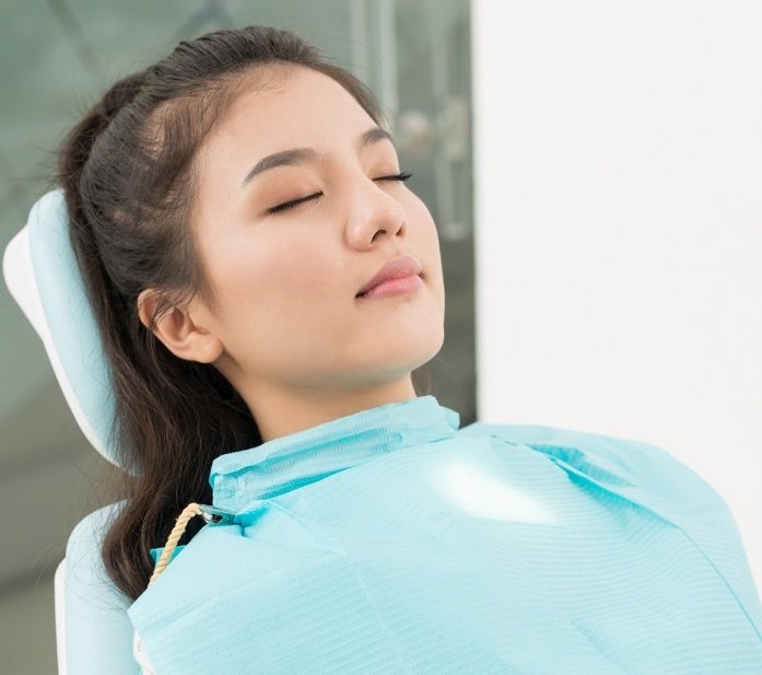 Young woman relaxing under sedation dentistry