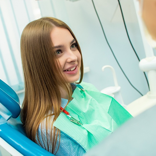 Patient smiling during oral conscious dental sedation visit