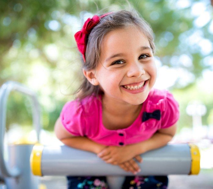 Little girl with healthy smile thanks to pediatric dentistry in Flower Mound